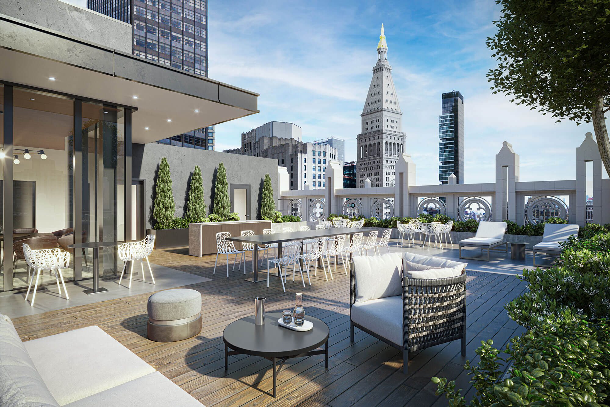 A beautiful terrace with white furniture and amazing view of NYC