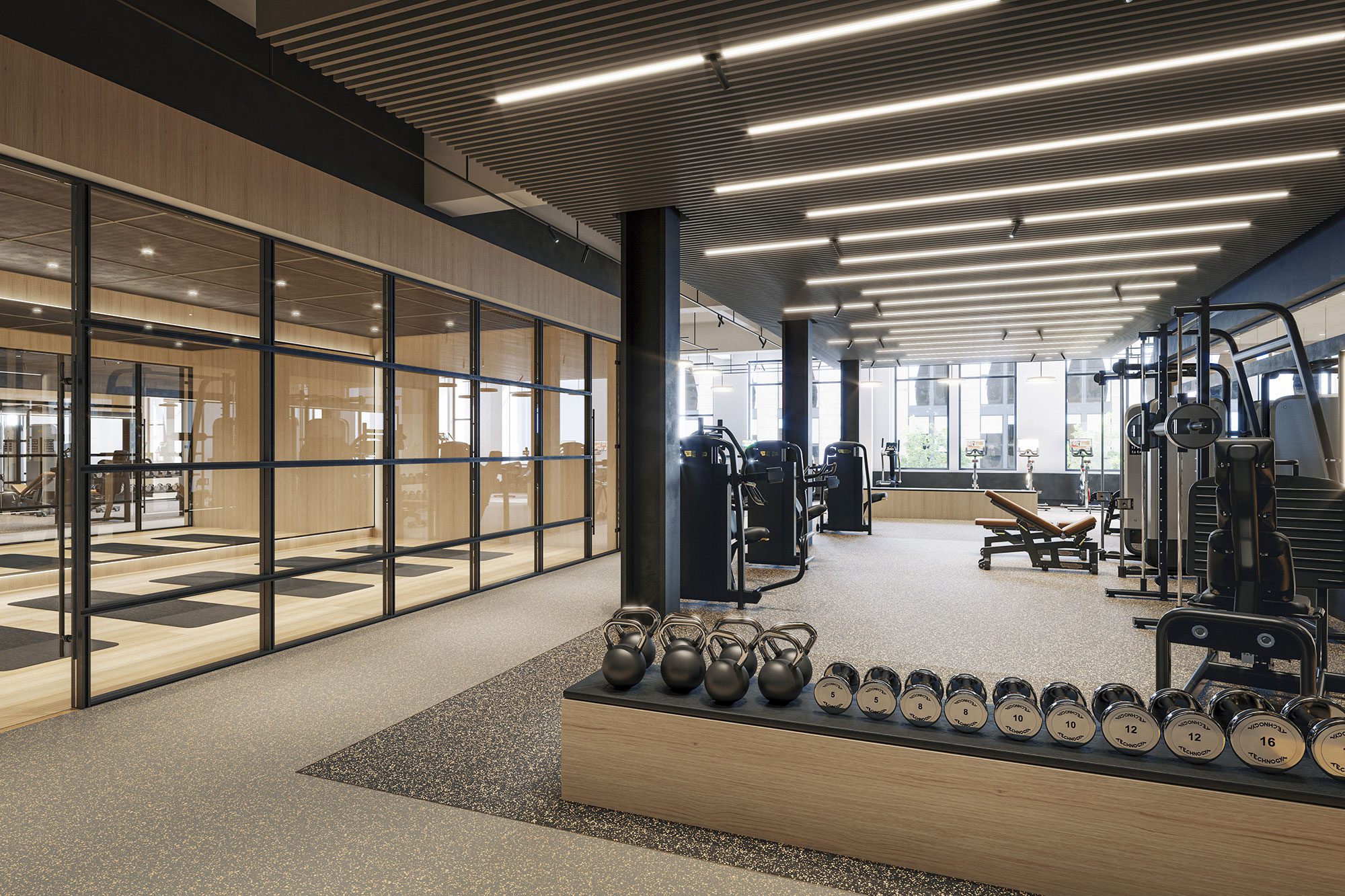 A full-sized gym with poly-laminate flooring and yoga studio